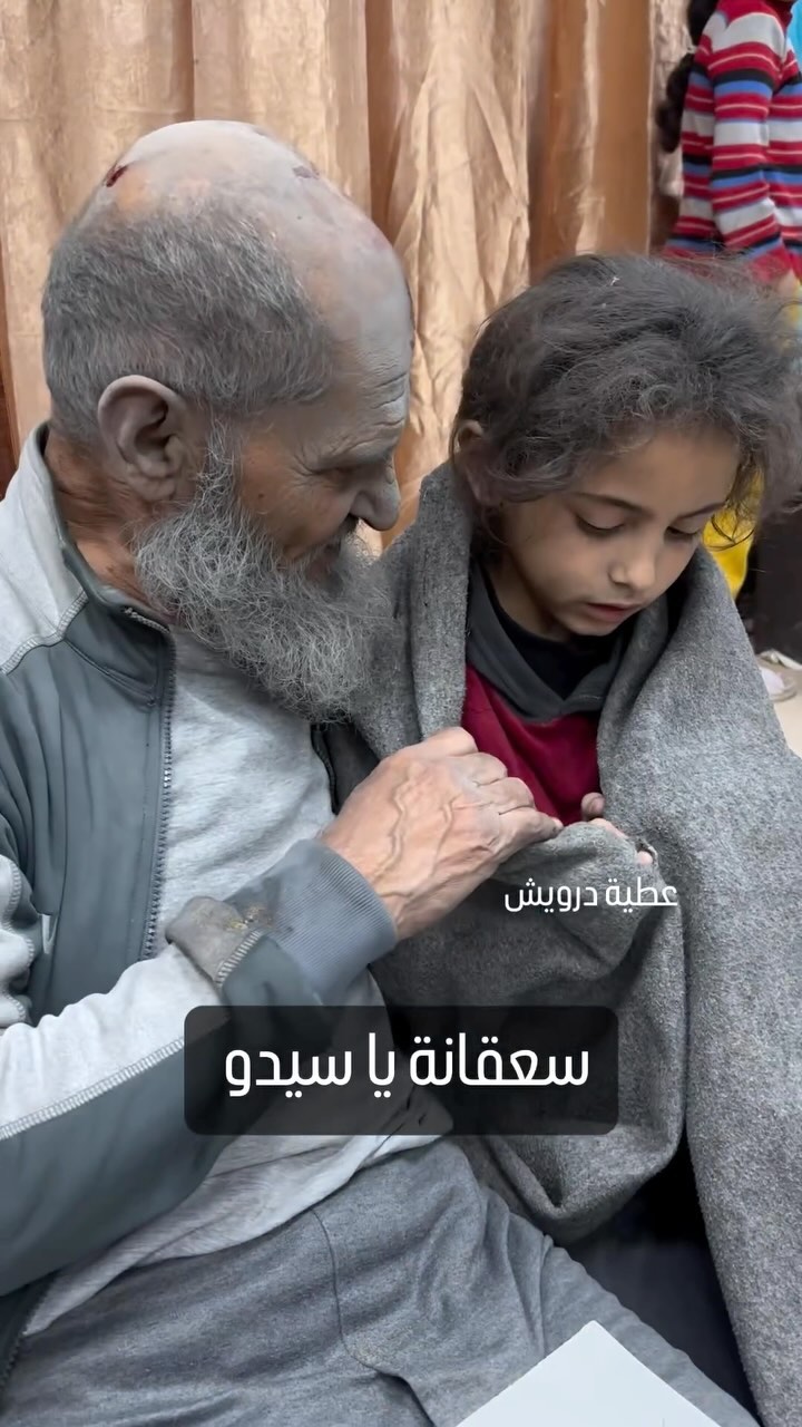 an-elderly-palestinian-man-embraces-his-granddaughter-who-feels-cold-following-their-arrival-to-the-hospital-after-they-…