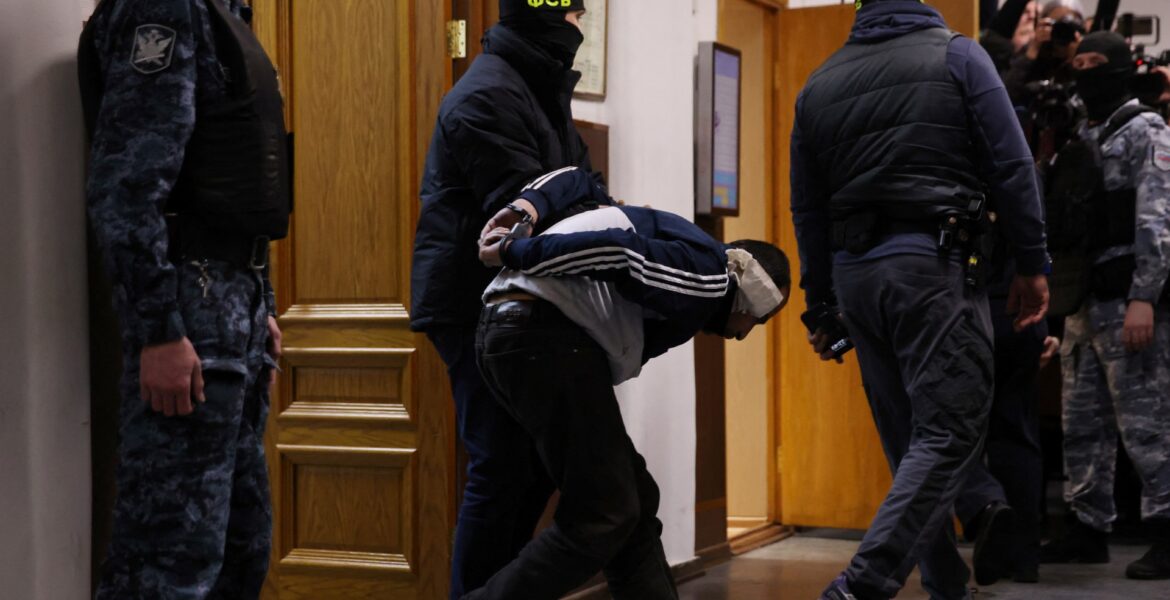 four-men-showing-signs-of-severe-beating-charged-over-moscow-concert-attack